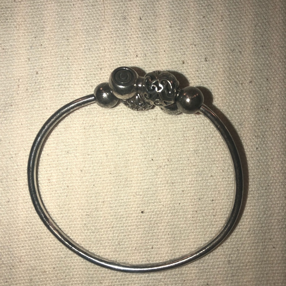 Silver Camilla flex bangle and two beads.